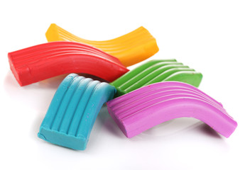 Children bright plasticine isolated on white