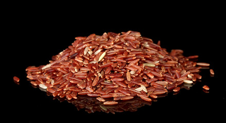 Red rice isolated on black