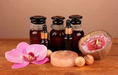 ingredients for soap making on brown background