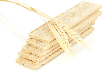 Fototapeta na wymiar Oat biscuits and wheat ears isolated on white