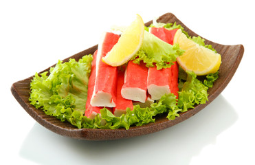 Crab sticks with lettuce leaves and lemon