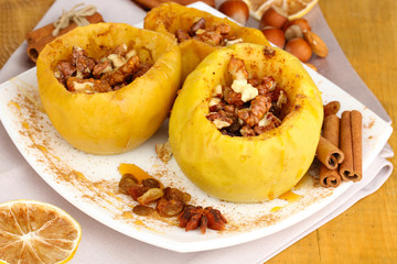 Baked apples on plate close up