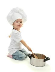 little girl doctor in chef's hat with pan and spoon, isolated