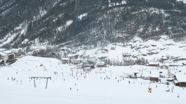 Tourists go on ski and snowboard on ski slope