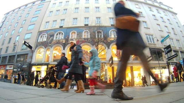 Tourists walk on central pedestrian street of Vienna - Kartner