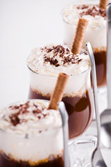 Close up photograph of a hot drink with whipped cream
