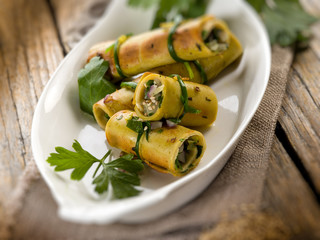 seitan rolled up with parsley and onion, selective focus
