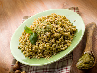 spelt with pesto sauce and hazel nut, vegetarian food