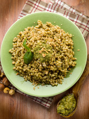 spelt with pesto sauce and hazel nut, vegetarian food