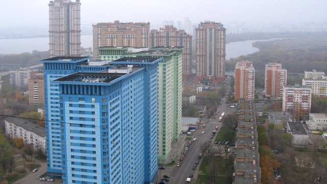 Skyscrapers stand in front of housing estate Crimson Sails