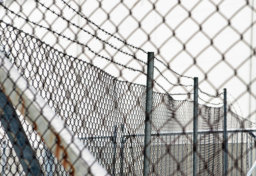 barbed wire and chainlink fence