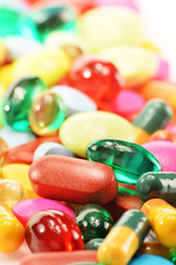 Composition with dietary supplement capsules and drug pills