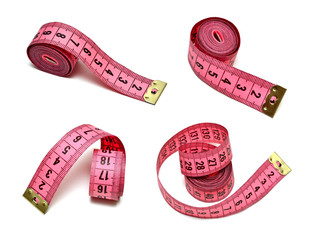 Pink measuring tape isolated on white - 47941685