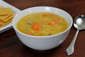 Vegetarian/Vegan Yellow Split Pea Soup  with Crackers and Spoon