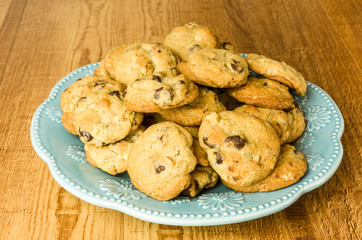 Blue plate of chocolate chip cookies