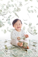 baby excited smile with money rain