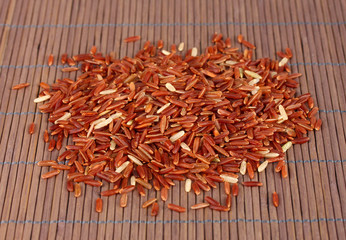 red rice   on bamboo mat
