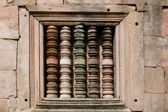 solid window frame with colorful balustre at Phonom Rung Temple