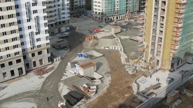 Builders work on building site of housing estate Losinyj island
