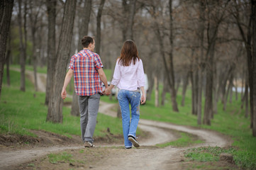 Fototapeta premium Teenagers Walking Along Alley