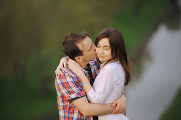 Obraz premium Kissing Young Couple