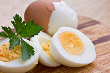 Boiled eggs on wooden board