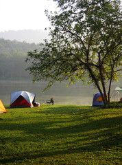 Tents in recreation area near the reservoir, Thailand.