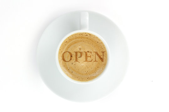 The inscription on coffee froth "open"