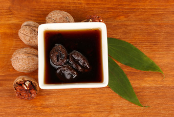 jam of walnutsjam walnuts in a bowl  on wooden table