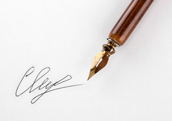 Fototapeta premium Closeup of signature (fake, not real) and ink pen, isolated