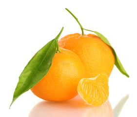 Ripe sweet tangerine with leaves, isolated on white