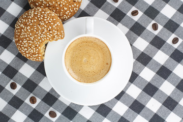 Coffee and cookies on a checkered tablecloth