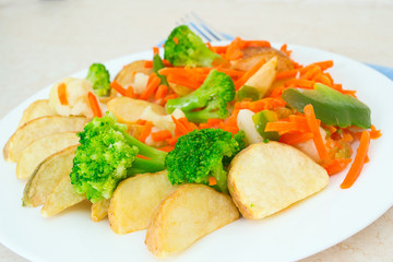 Mixed vegetables on a plate with fork