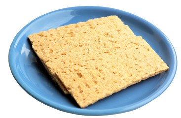 Crackling rye bread on a blue ceramic plate.
