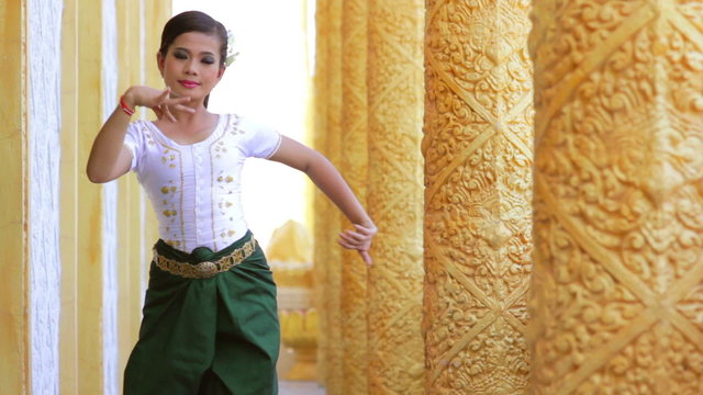 Beautiful Asian Girl performs cambodian folk dance in temple