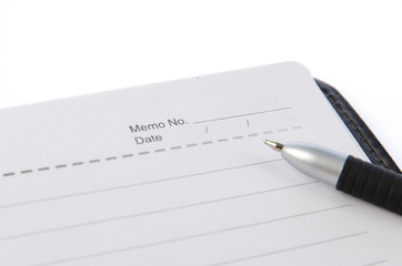 Notebook and pen on white background