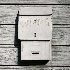Traditional old mail box on the wooden wall
