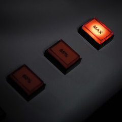 Illuminated max button on industrial power control panel