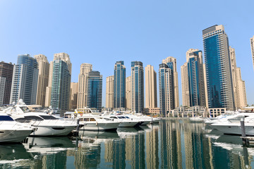 Obraz na płótnie Canvas Dubai Marina Yacht and Skyscrapers
