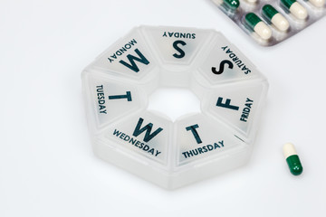 Pills in weekly container
