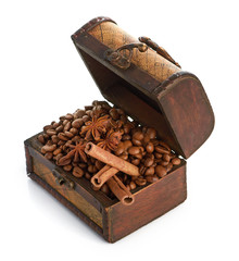 coffee beans and cinnamon sticks inside a  chest