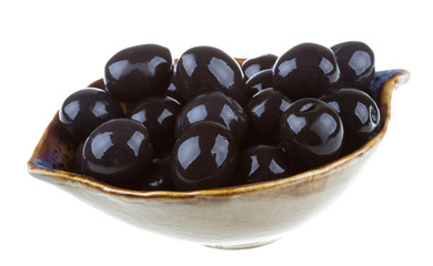 Olives black watered with olive oil in a bowl isolated on a whit