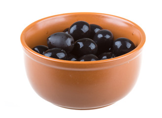 Olives black watered with olive oil in a bowl isolated on a whit