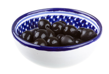 Olives black watered with olive oil in a bowl isolated on a whit