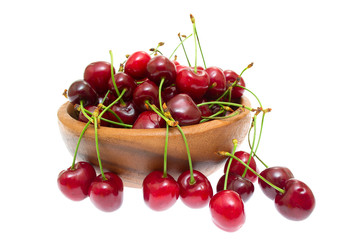 Obraz na płótnie Canvas Cherry in wooden bowl isolated on white background