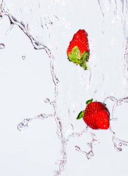 Fresh strawberries in wall of water