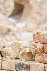 Demolition industry machine taking down walls of factory