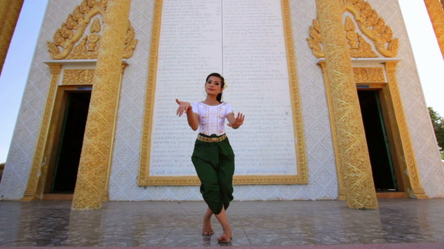 Beautiful Asian Girl performs cambodian folk dance in temple