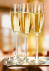 Corporate party: sparkling champagne glasses on tray