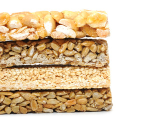 Honey bars with peanuts on white background